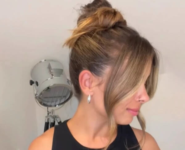 Messy Top Knot with Face-Framing Pieces