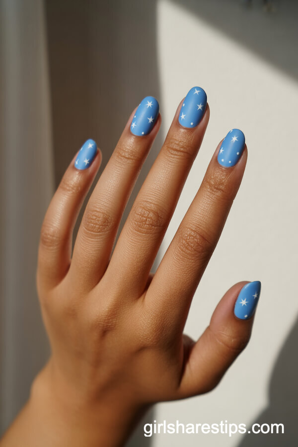Sky Blue Matte Round Nails with Tiny White Star Accents