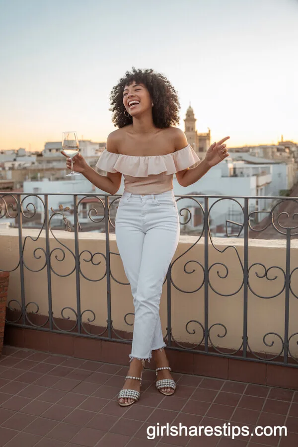 Ruffled Off-Shoulder Top with White Jeans on the Rooftop