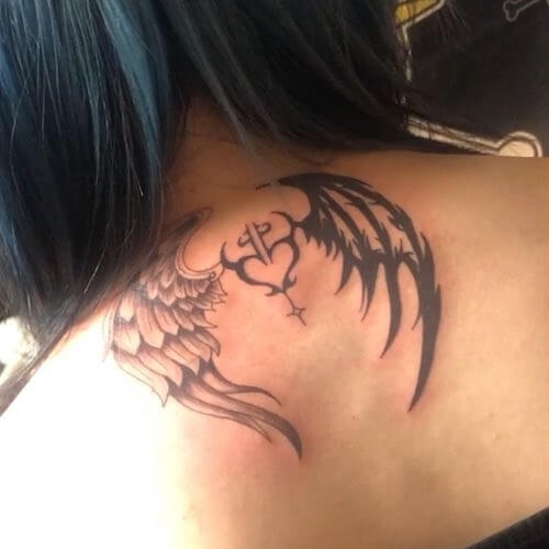 angel wing and cross tattoo meaning