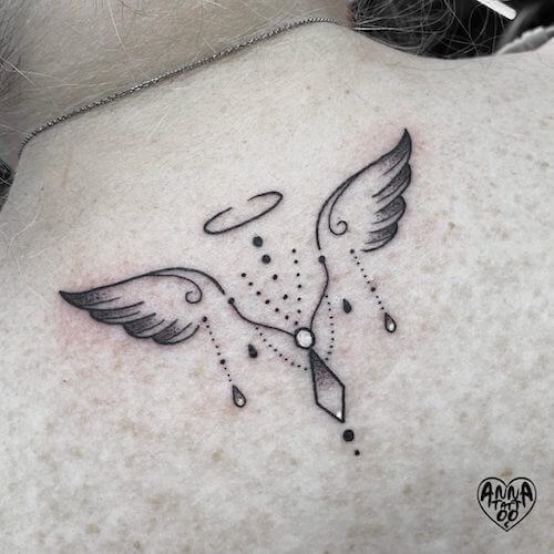 white ink angel wing tattoo