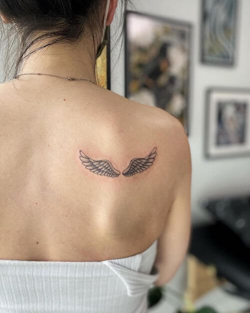 black wings tattoo meaning and designs