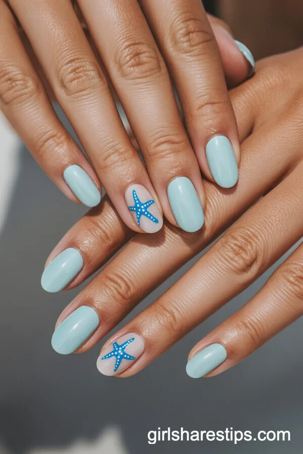 Pastel Blue Oval Nails with Starfish Accents