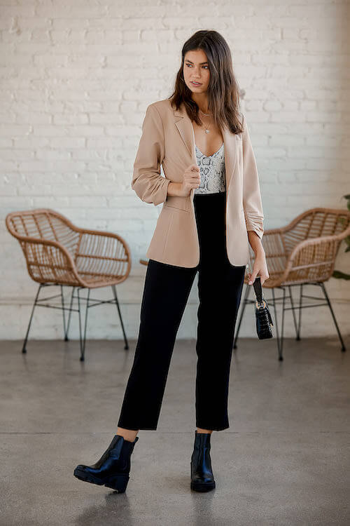 beige blazer, bodysuit, and black pants