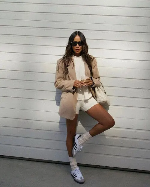 beige blazer, white shorts, and sneakers