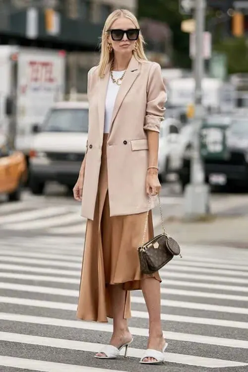 beige blazer, white shirt, and maxi skirt