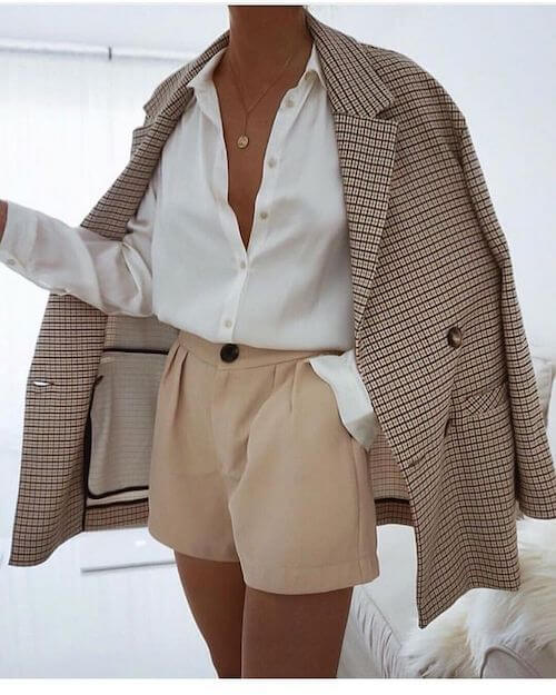 beige blazer, white button down shirt, and shorts