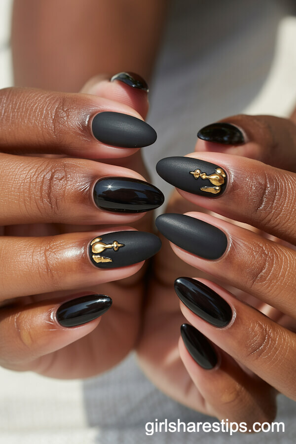 Oval Nails with Glossy and Matte Black, Accented by Gold Details