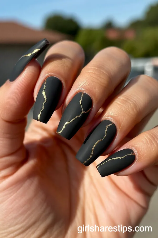Matte Black Coffin Nails with Delicate Gold Vein Accents
