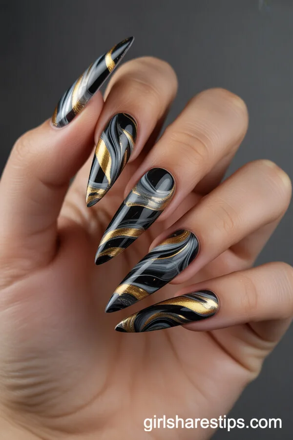 Black and Gold Marble Swirl Stiletto Nails