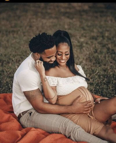 black couple outdoor maternity shoots