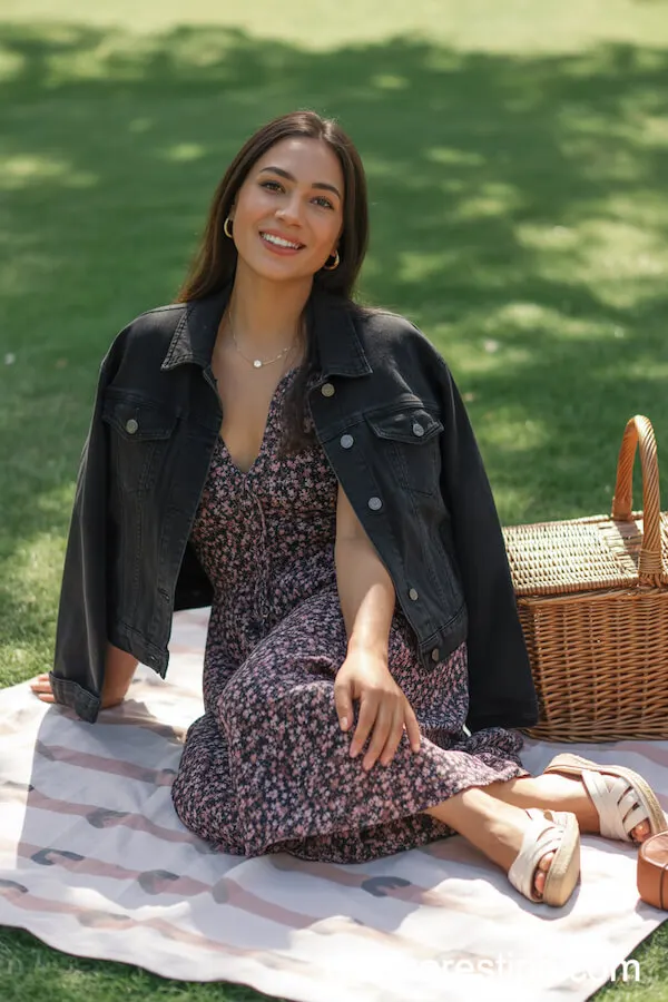 Black Denim Jacket Draped Over a Floral Maxi Dress