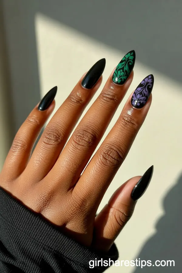Stiletto Black Nails with Gothic Purple and Emerald Floral Accent