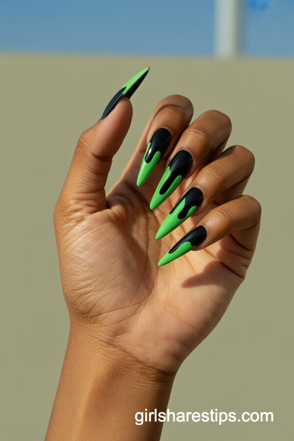 Glossy Black Stiletto Nails with Neon Green Drip