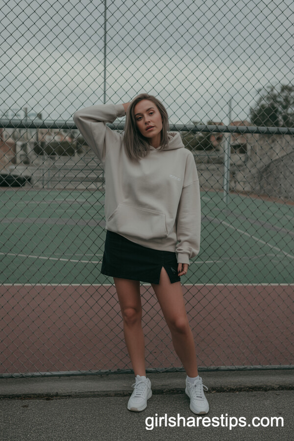 Urban Active: Black Mini Skirt with Oversized Hoodie and White Sneakers