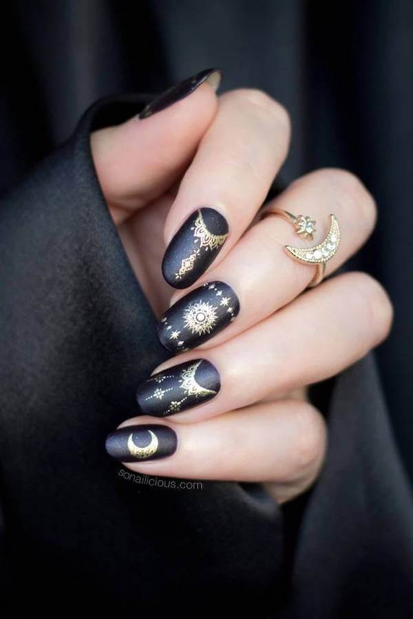 Black Matte Nails with Gold Moon and Sun Designs