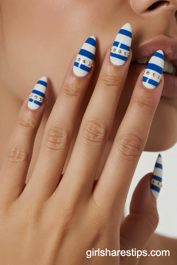 Striped Stiletto Nails With Gold Stud Accents