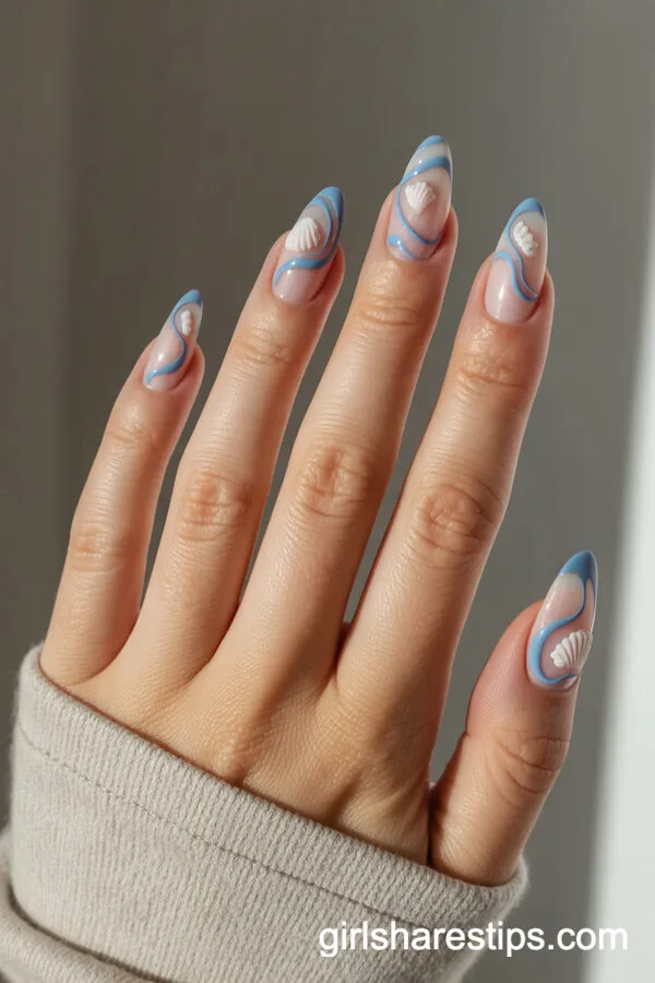 Blue Waves and Seashell Almond Nail Designs