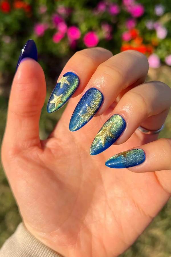 Blue Cat Eye Nails with Gold Foil Star Accents