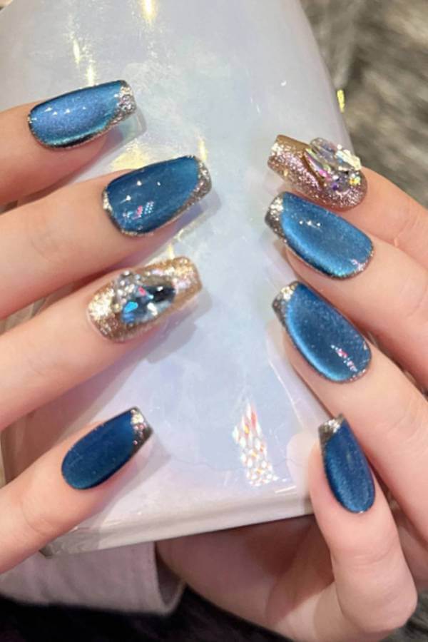 Blue Cat Eye Nails with Glitter and Gems