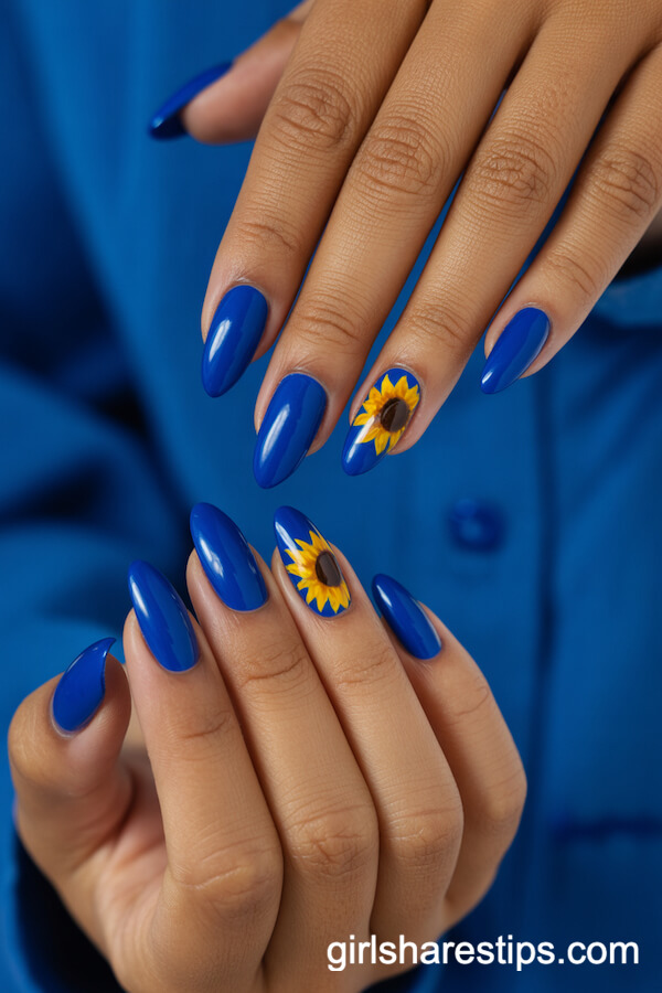Royal Blue Almond Nails with Sunflower-Inspired Blue Accent