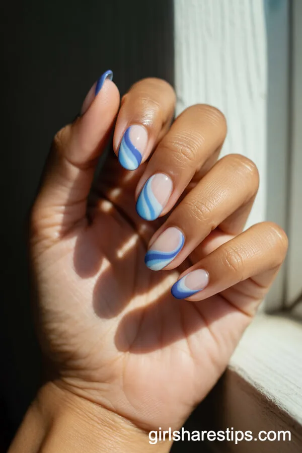 Almond Nails with Swirled Two-Tone Blue Designs