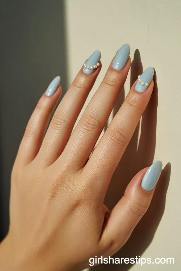 Soft Blue Almond Nails with Pearl Accents
