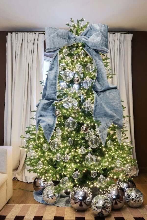 Christmas Tree with Large Blue Bow and Silver Ornaments
