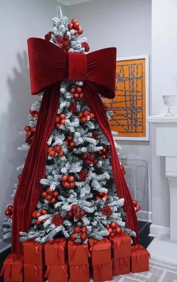 Flocked Christmas Tree with Bold Red Velvet Bow