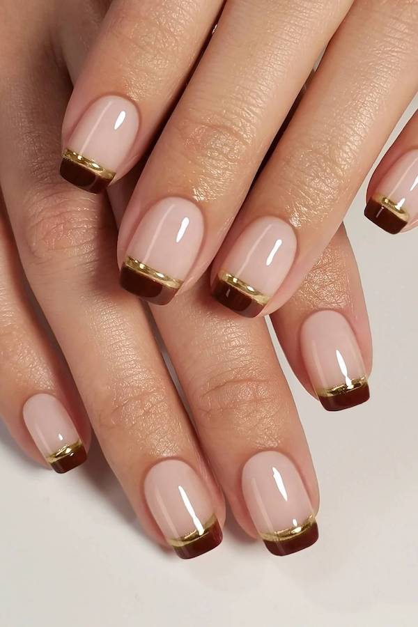 Brown French Tip Nails with Gold Stripe