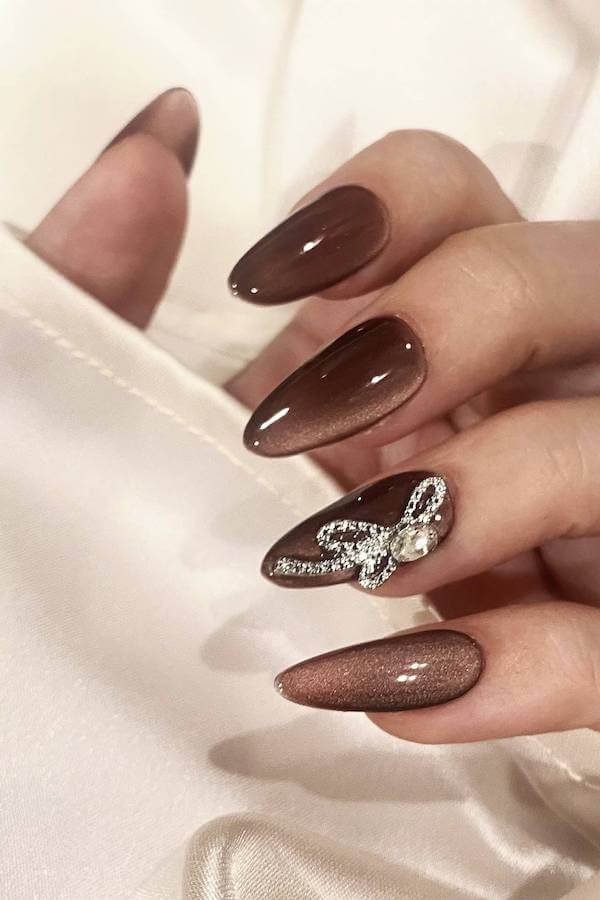 Brown Cat Eye Nails with Rhinestone Bow