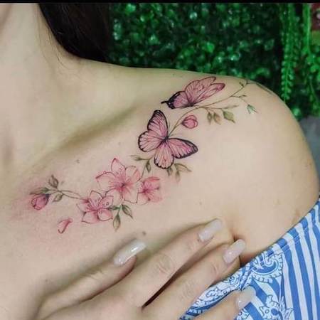 Pink Butterfly and flower tattoo on shoulder