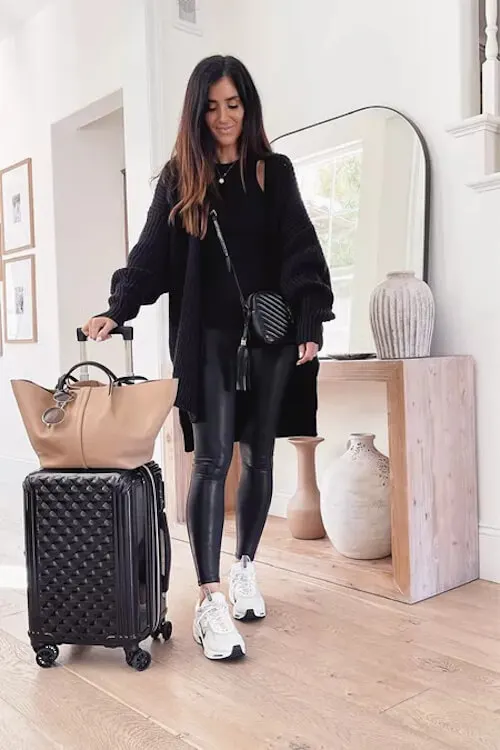 all black outfits and white sneakers for chic travel style