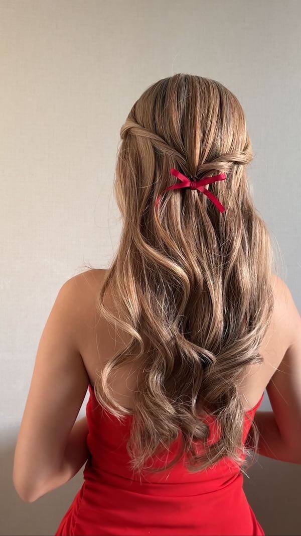 Festive Red Bow Half-Updo Style