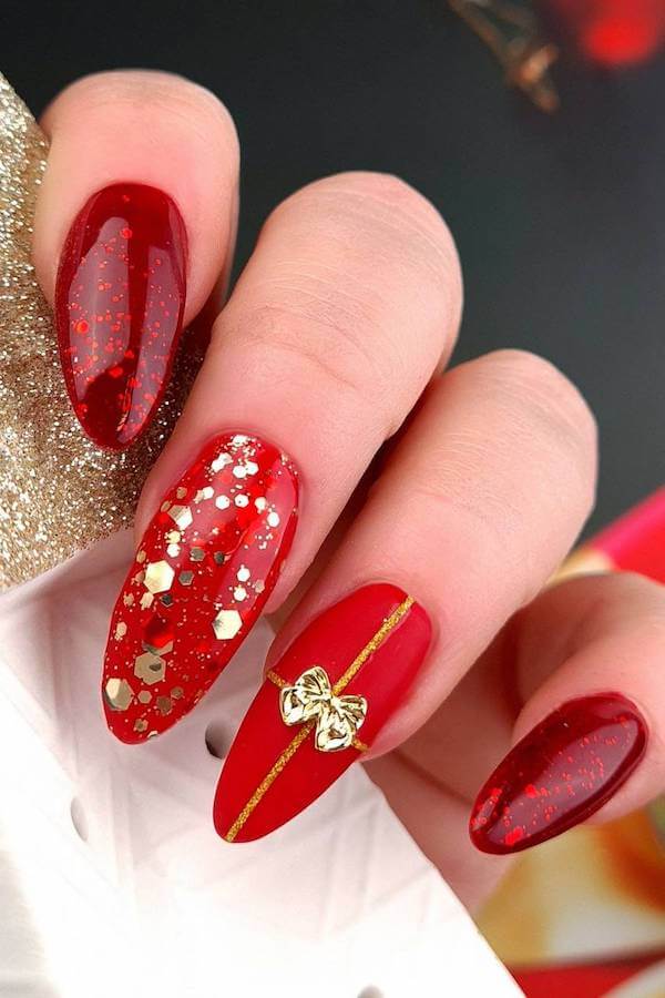 Red and Gold Festive Bow Nail Design