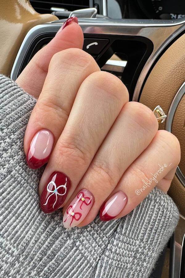 Burgundy French Tip Nails with Bow Accents