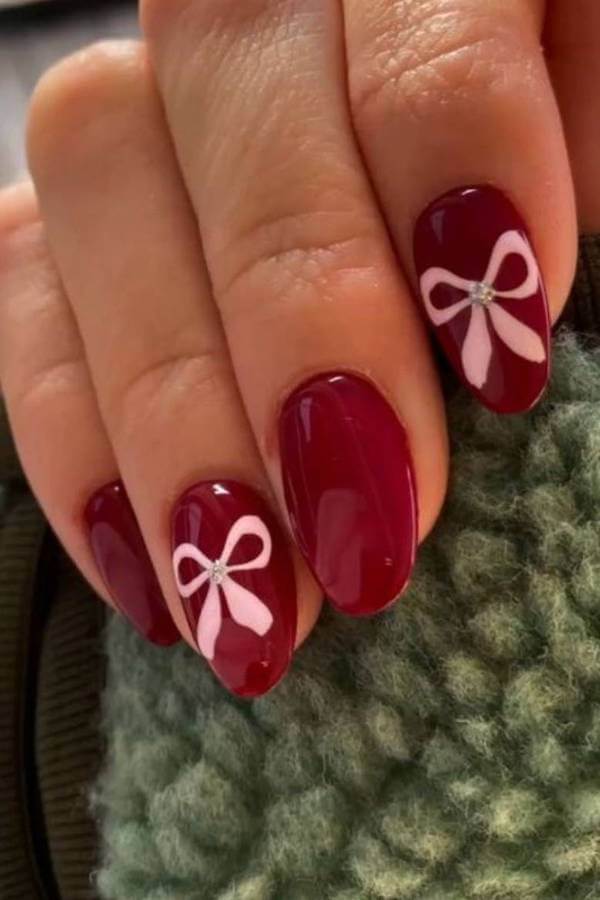 Classic Red Nails with Pink Bow Design