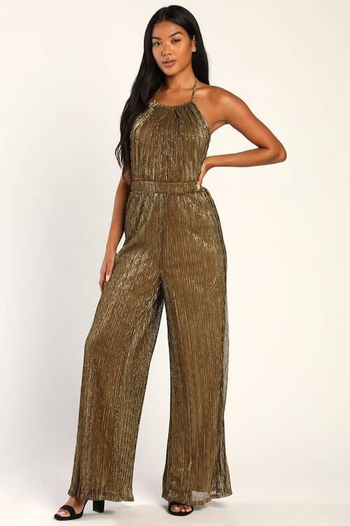 gold jumpsuit and black shoes for a chic party look