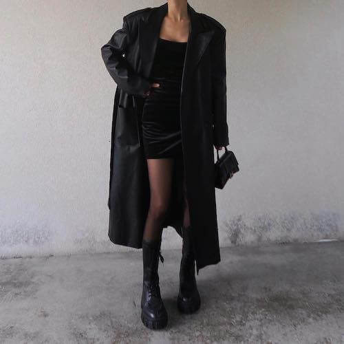 a long black coat and a black mini dress combo