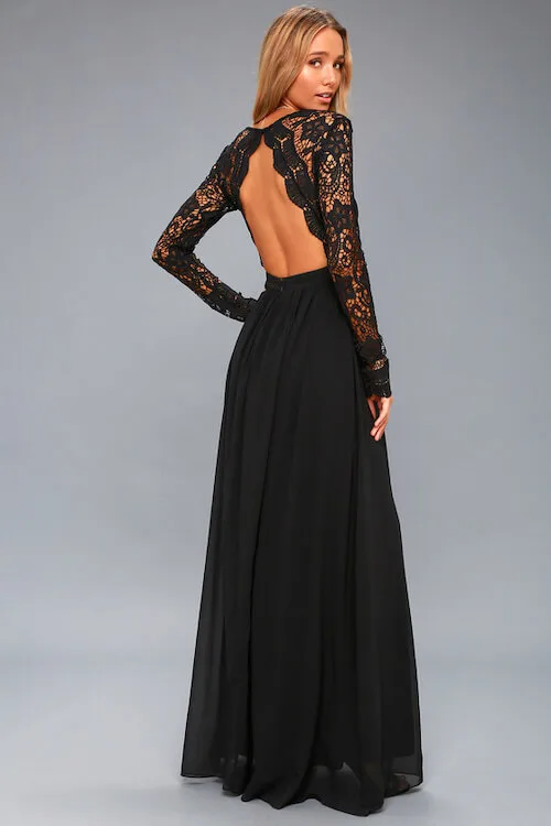 a woman wearing a maxi backless black lace dress