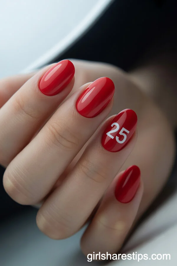 Glossy Red Short Oval Nails With Minimalist Class Year Accent