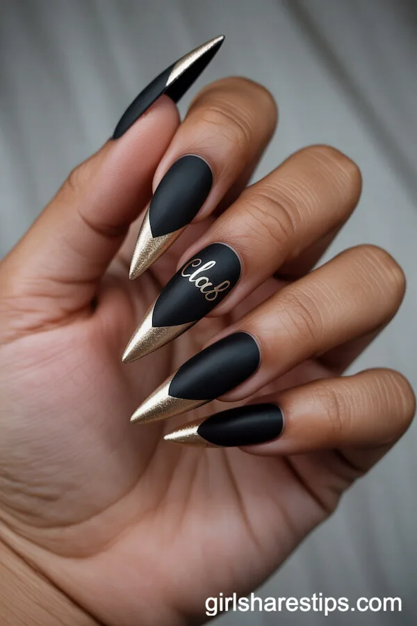 Matte Black Stiletto Nails With Gold Foil and Class Year Accent