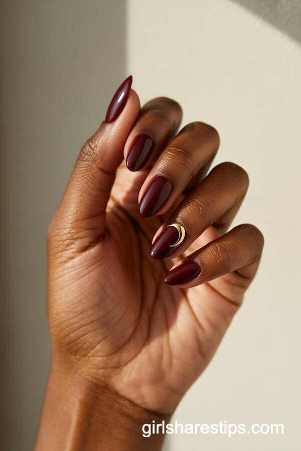 Glossy Wine Red Nails with Gold Crescent Moon