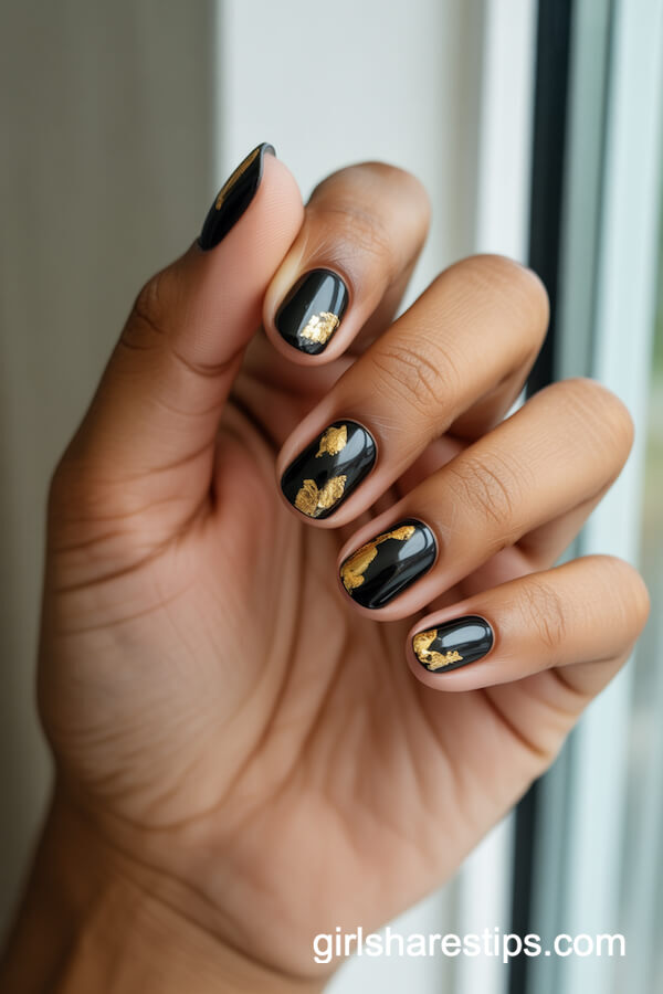 Glossy Black Nails with Gold Foil Flakes