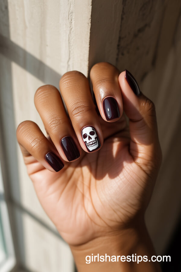 Dark Plum Nails with Intricate White Skull