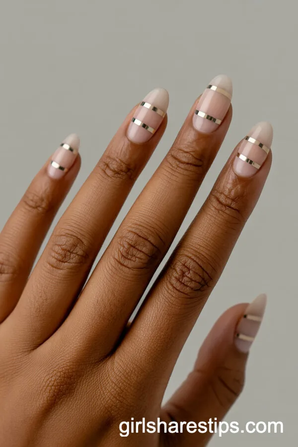 Nude Oval Nails with Geometric Gold Striping