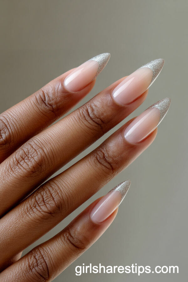 Almond Nude Nails with Thin Silver Glitter French Tips