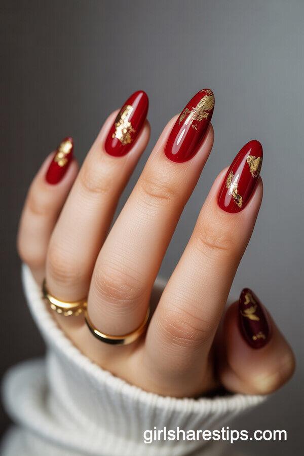 Deep Red Almond Nails with Gold Foil Accents
