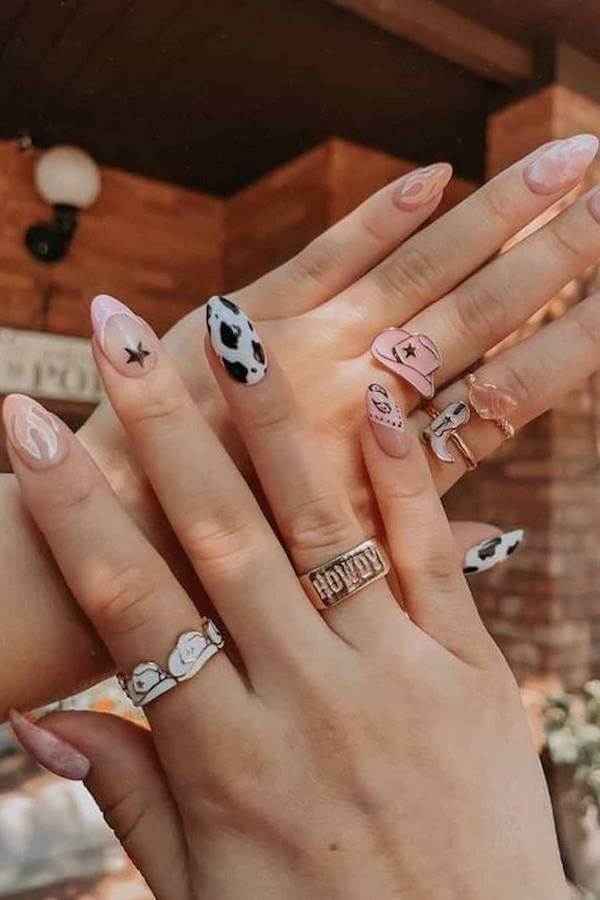 Cow Print and Star Accent Nails