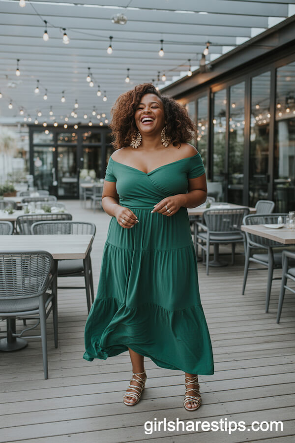 Deep green off-shoulder maxi dress with gold statement earrings